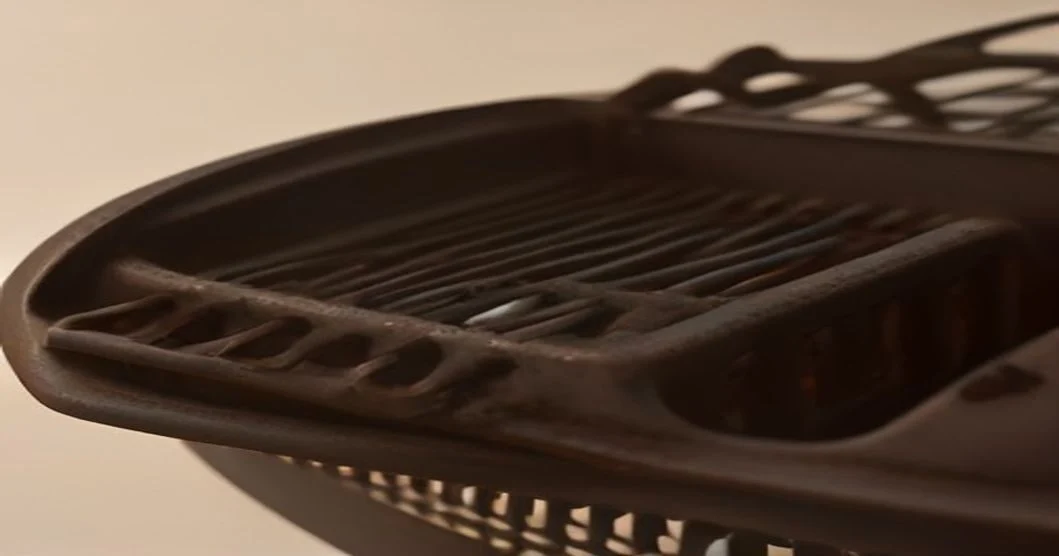 Rusty Charcoal Grill Grates being cleaned